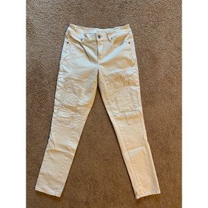 American Eagle jeans, cream with eyelet patches, size 8